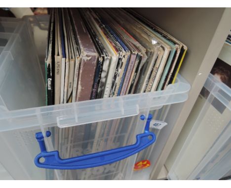 Approx 45 LP vinyl records, mixed genre, including Jimi Hendrix, Status Quo, The Virgins, Carly Simon, Jethro Tull, Moody Blu