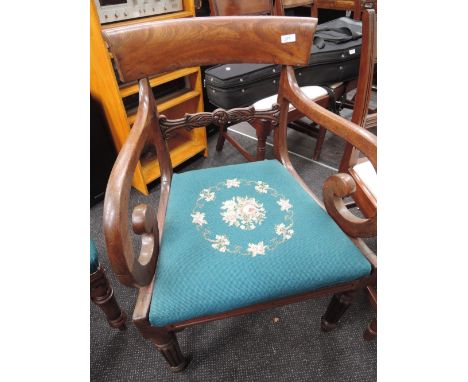 A William IV mahogany dining armchair having scroll rail back with later turquoise tapestry seats 