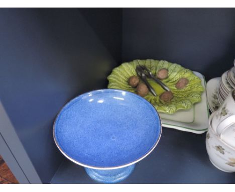 A Mintons square plate having turkey decoration, a Royal Doulton tazza in mottled blue ground and a novelty ceramic leaf dish