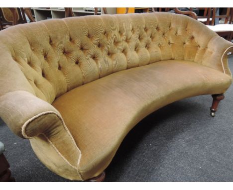 A late Victorian sofa on mahogany turned legs having 1970's gold dralon upholstery