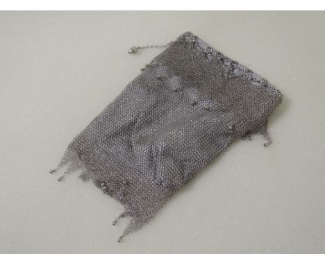 A white metal chain mail evening bag having moulded acorn decoration and later lining, no marks