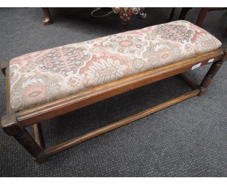 A late 20th century oak frame period style footstool having tapestry top