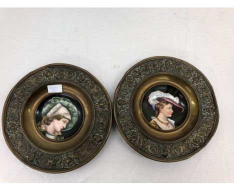 A pair of plates with ceramic insects