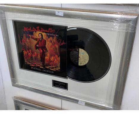 A framedf &amp; glazed autographed Michael Jackson album signed to the cover by Michael Jackson, Slash, Nile Rodgers, Steve P