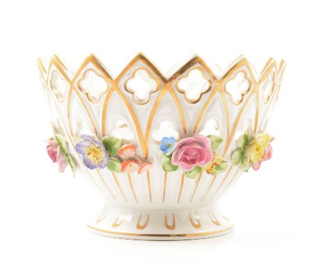 A pair of Greman four light porcelain candelabra, VEB Porzellan Manufaktur, Plaue, encrusted with flowers, the bases modelled