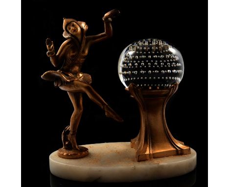 Art Deco figural table lamp, by Gerdago, formed as a dancer in stylised costume next to a pedestal supporting a glass paperwe