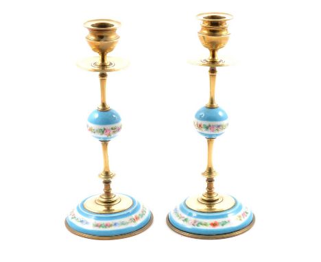 A pair of brass candlesticks with pale blue ceramic detail, floral banding, removable sconces, 22cm.