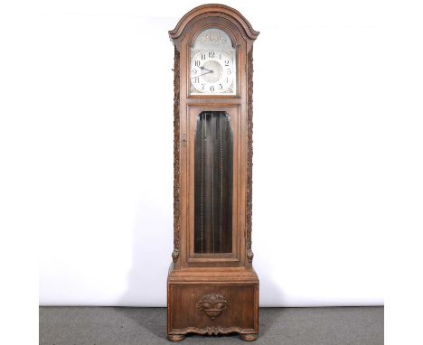 Oak longcase clock, circa 1900, the case labelled Joel Galleries, Newcastle, silvered dial with cast spandrels, triple chain 