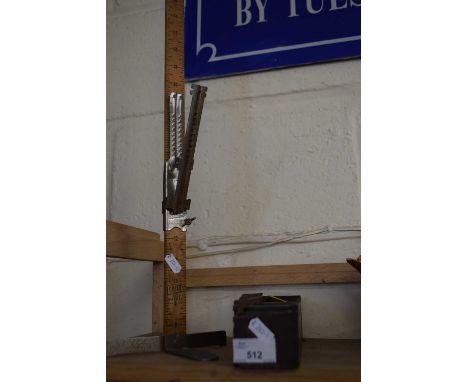 Case of dominoes and a vintage wooden skirt marker