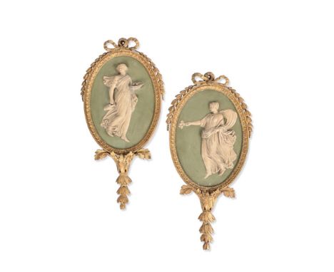 A PAIR OF GEORGE III PARCEL GILT AND PLASTER RELIEF PLAQUES  IN THE MANNER OF ROBERT ADAM, CIRCA 1760-1780  With Neoclassical