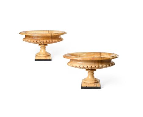 A PAIR OF OVAL SIENA MARBLE TAZZA 20TH CENTURY Semi fluted, on square plinth bases each 31cm high, 52cm diameter   Condition 