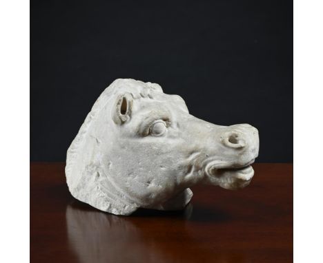 A ROMAN WHITE MARBLE HEAD OF A HORSE  CIRCA 2ND CENTURY AD  Inclined upwards, the mouth slightly open  16.5cm high, 26cm long