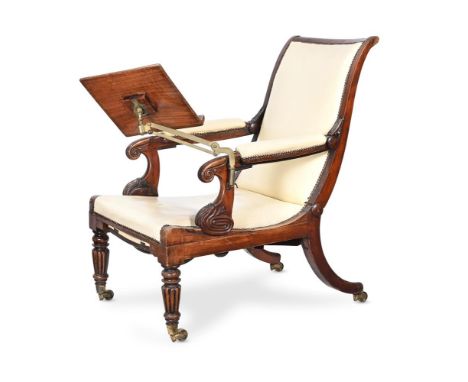 A GEORGE IV SIMULATED ROSEWOOD ADJUSTABLE LIBRARY ARMCHAIR BY ROBERT DAWS, CIRCA 1825 With a mahogany and brass book rest and