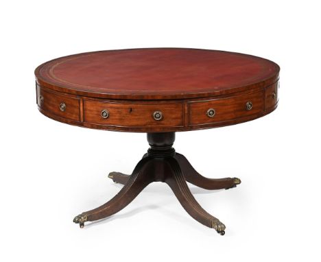 A GEORGE III MAHOGANY DRUM LIBRARY TABLE CIRCA 1790 The top with a gilt tooled leather inset, the four frieze drawers intersp