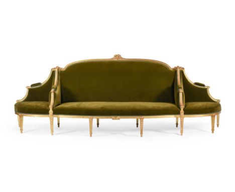 A FINE AND RARE GEORGE III CARVED GILTWOOD CONFIDANTE SOFA IN THE MANNER OF WILLIAM & JOHN LINNELL, IN THE FRENCH NEO-CLASSIC