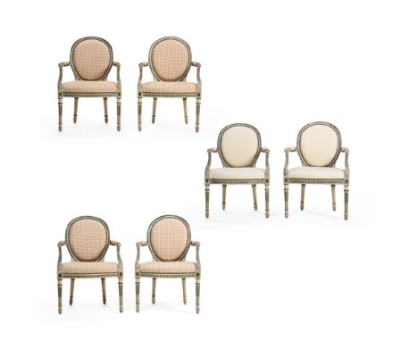 A SET OF SIX GEORGE III PALE GREY AND GREEN PAINTED ARMCHAIRS IN THE MANNER OF THOMAS CHIPPENDALE, CIRCA 1775 Four chairs wit