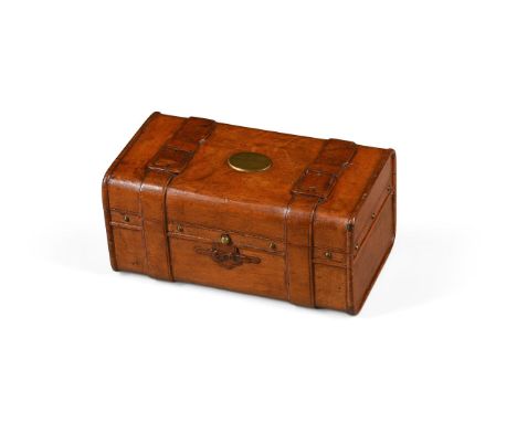 A FRENCH NOVELTY FRUITWOOD TREEN SEWING BOX  LATE 19TH CENTURY  Of trunk form, with carved straps and handles, the hinged lid