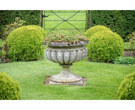 A LARGE COMPOSITION STONE GADROONED VASE  IN THE MANNER OF AUSTIN & SEELY, SECOND QUARTER 19TH CENTURY  approximately 72cm hi