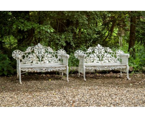 A PAIR OF CAST IRON GARDEN BENCHES IN THE COALBROOKDALE OAK & IVY PATTERN  20TH CENTURY  approximately 145cm wide, 92cm high 
