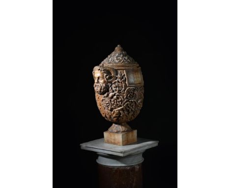 AFTER THE ANTIQUE, A PLASTER CINERARY OR SEPULCHRAL URN  20TH CENTURY  Leaf moulded body and lid around inscription panel, tw