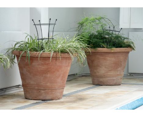 A PAIR OF OVERSIZED TERRACOTTA POTS  MODERN  Twin rib decoration to tapering cylindrical bodies  approximately 79cm high, top