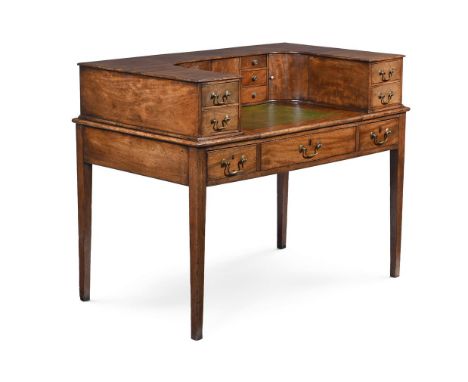 A GEORGE III MAHOGANY CARLTON HOUSE DESK CIRCA 1800 In two sections, the upper part with drawers, the base with a pull out le