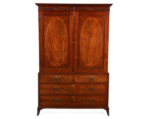 Y&nbspA GEORGE III MAHOGANY CLOTHES PRESS BY GILLOWS, CIRCA 1770 The top edge of one drawer stamped GILLOWS LANCASTER 193cm h