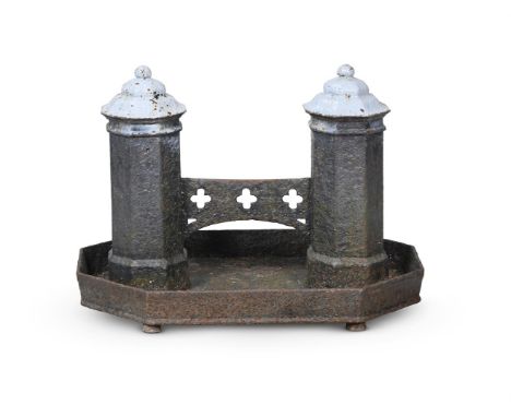 A LARGE CAST IRON GOTHIC BOOT SCRAPER OF COUNTRY HOUSE PROPORTIONS  CIRCA 1830-1850  Twin turret ends with quatrefoil pierced