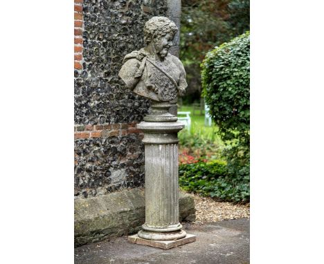 A LARGE COMPOSITION STONE BUST OF PAN ON PEDESTAL  20TH CENTURY  The bust in the Neoclassical manner, on fluted column  201cm