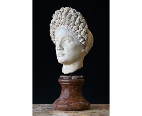 A MARBLE HEAD OF A ROMAN LADY  IN THE LATE 1ST CENTURY A.D MANNER  With dressed and coiled hairstyle in the Flavian (later 1s