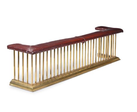 A LARGE BRASS AND CRIMSON LEATHER UPHOLSTERED CLUB FENDER  EARLY 20TH CENTURY 67cm high, 281cm wide, 55cm deep overall   Cond