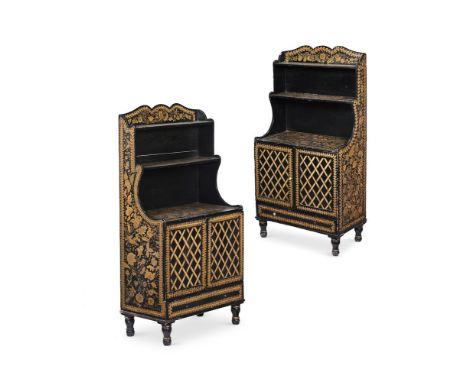 A PAIR OF EBONISED AND PENWORK DECORATED WATERFALL BOOKCASES FIRST HALF 19TH CENTURY each 126cm high, 67cm wide, 36cm deep   