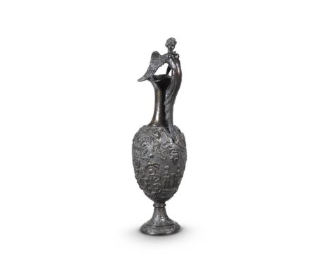 A GRAND TOUR BRONZE EWER  AFTER BENVENUTO CELLINI, 19TH CENTURY  Gilt scroll work decoration to the neck above richly decorat