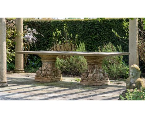 A LARGE TERRACOTTA AND COMPOSITION STONE TABLE  19TH CENTURY AND LATER  The bases circa 1860, formed from foliate capitals in