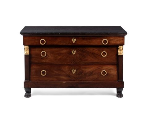 AN EMPIRE MAHOGANY AND ORMOLU MOUNTED COMMODE IN THE MANNER OF BERNARD MOLITOR, CIRCA 1810 With a fossilised black marble top