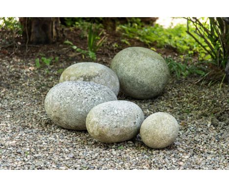 FIVE CORNISH GRANITE EGGS  POSSIBLY PREHISTORIC  Often referred to as 'dinosaur eggs'  graduated sizes, the largest 50cm wide