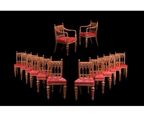 A SET OF FOURTEEN GEORGE IV OAK DINING CHAIRS IN THE MANNER OF GEORGE SMITH, IN GOTHIC REVIVAL TASTE, CIRCA 1830 To include a