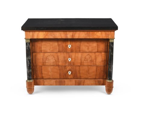 A CONTINENTAL BIRCH AND SIMULATED MARBLE COMMODE CIRCA 1840 With gilt metal mounts 85cm high, 112cm wide, 58cm deep