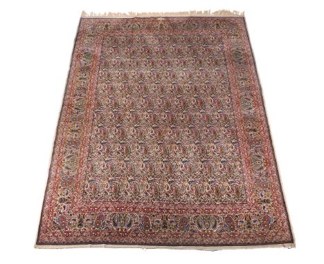 A KIRMAN CARPET SIGNED BY MASTER WEAVER BROOMAND approximately 395 x 291cm