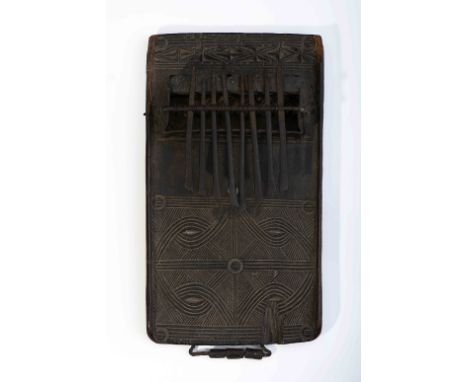 A kisanji, wood and iron lamellophone, carved decoration "Geometric motifs" and "Capuita Symbol", Angolan - Tshokwe, 20th C. 