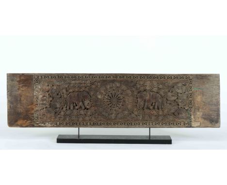An architectural panel, carved teak "Elephants among plant windings", medallions "Birds composing rosettes", Indian, 19th C.,