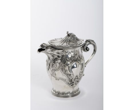 A pitcher with cover, rocaille style, 916/1000 silver, decoration en relief "Shell motifs", bird shaped spout, gilt silver in