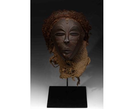 A «Mwana Pwo» Mask, wood, fibers and metal, mask representing the ideal of female beauty, used by professional dancers in var