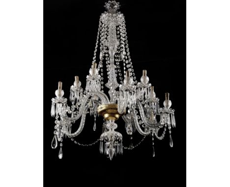 A twelve-light chandelier, gilt metal frame, glass and moulded and cut crystal arms and pendants, gilt glass goblet, 20th C.,
