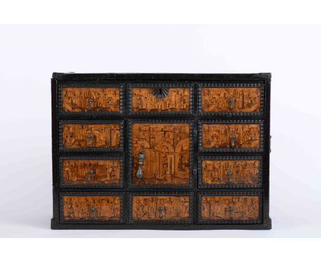 A cabinet with flip-up top, mannerist, walnut, full ebony wood coating, central door occupying the height of two drawers, dra