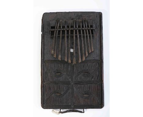 A Kisanji, wood and iron lamellaphone, engraved decoration "Capuita Symbols" on vertical friezes, Angolan - Tshokwe (related 