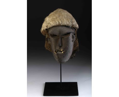 A «Katoyo» Mask, wood, ivory, fiber and fur, mask possibly representative of the western man, Angolan - Tshokwe, 20th C. (mid