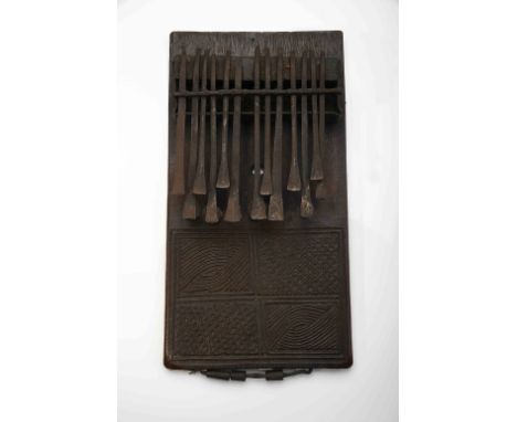 A Kisanji, a wood and iron lamellophone, double lamella frieze, engraved decoration "Geometric motifs", partly representing t