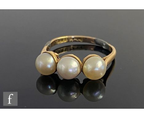 An early 20th Century 18ct three stone spilt pearl ring, weight 2.9g, ring size P, A/F. 