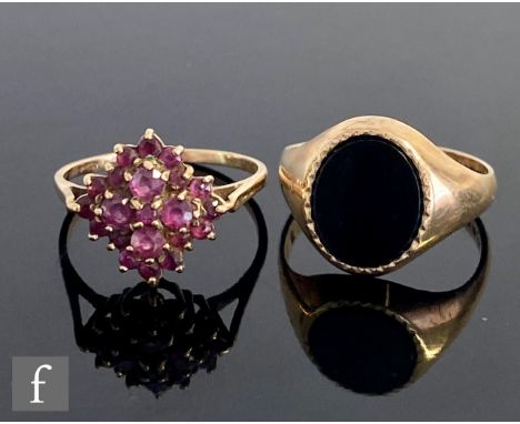 A 9ct hallmarked onyx set signet ring with a 9ct ruby cluster ring, total weight 6.3g. (2) 